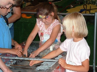 Kids learning about watershed at fair booth